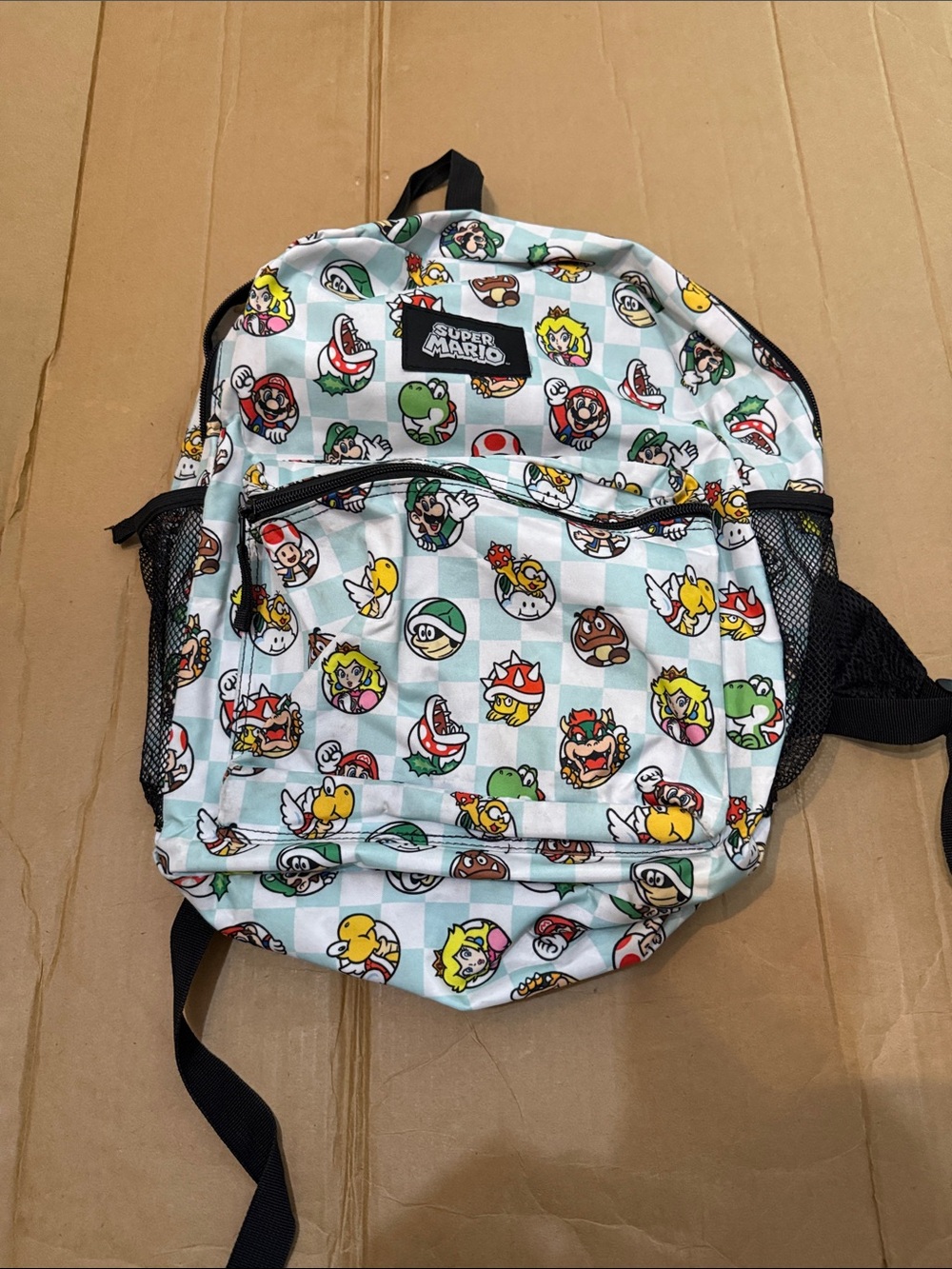 Nintendo Super Mario Kids Backpack in Light Blue and Black with Character Icons